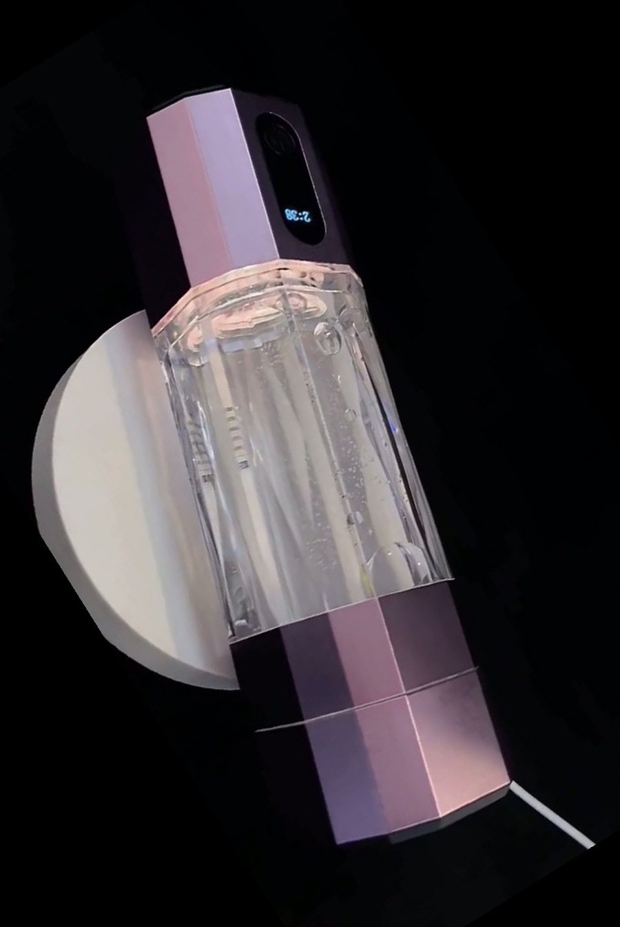 QY01 hydrogen water bottle standing upright on its charging base
