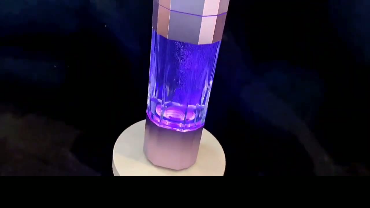 QY01 bottle on its wireless charging base with the indicator lit