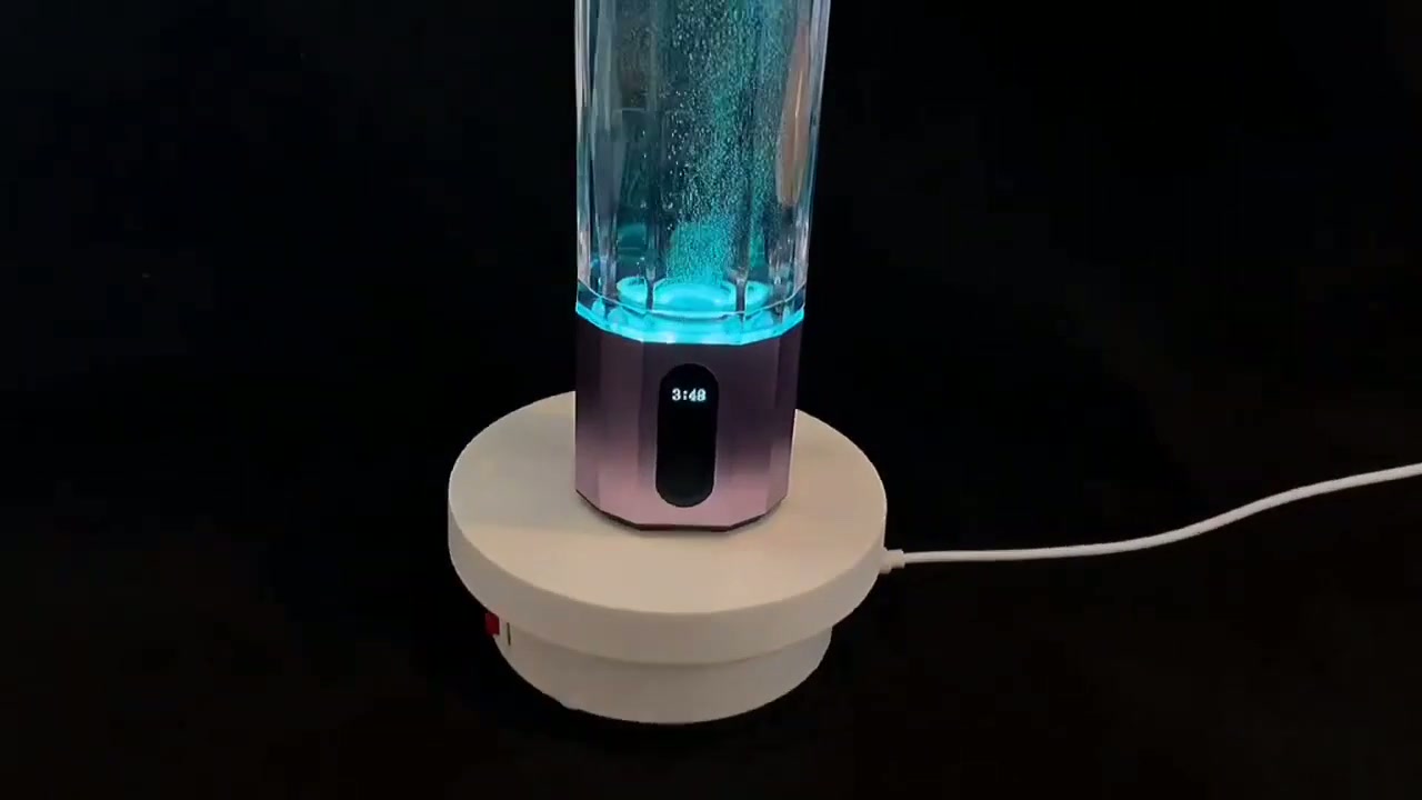 QY01 bottle on its charging base with the cycle timer showing