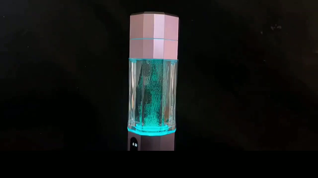 QY01 bottle mid-cycle with the water lit in teal